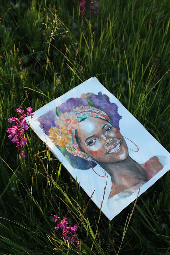Crafting Captivating Headlines: Your awesome post title goes here Colorful portrait painting of a smiling woman lying on grass surrounded by wildflowers.