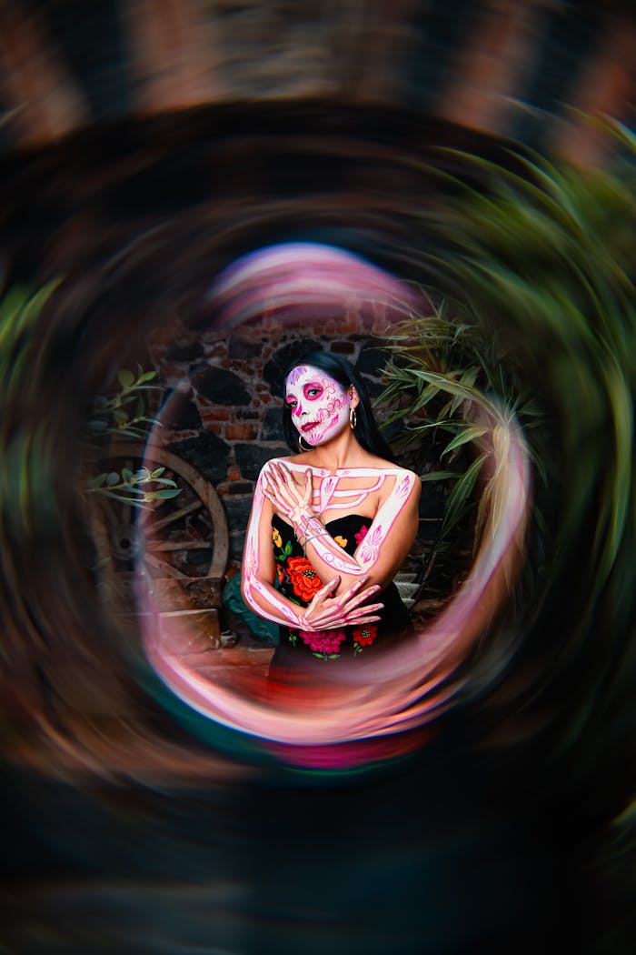 Mastering the First Impression: Your intriguing post title goes here Vibrant portrait of a woman celebrating the Day of the Dead with artistic face paint in a dynamic setting.